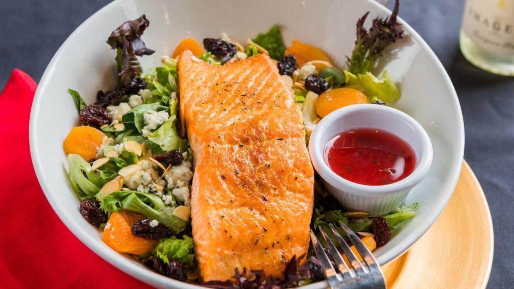 Apricot Salmon Salad · Mixed greens with dried apricots, dried cherries, walnuts, bleu cheese, and fresh broiled salmon. Served with raspberry vinaigrette.