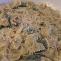 Pesto Farfalle · Grilled marinated chicken with creamy pesto sauce and bow-tie pasta topped with Parmesan che...