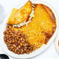Mexican Plate · Two cheese enchiladas topped with our homemade beef chili sauce, flour fried beef taco, and ...