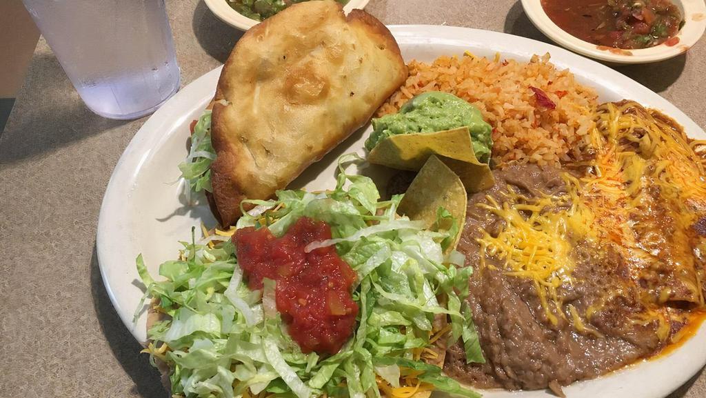 Special Plate · A flour fried beef taco, a cheese enchilada, a bean corn tostada, rice, beans and guacamole.