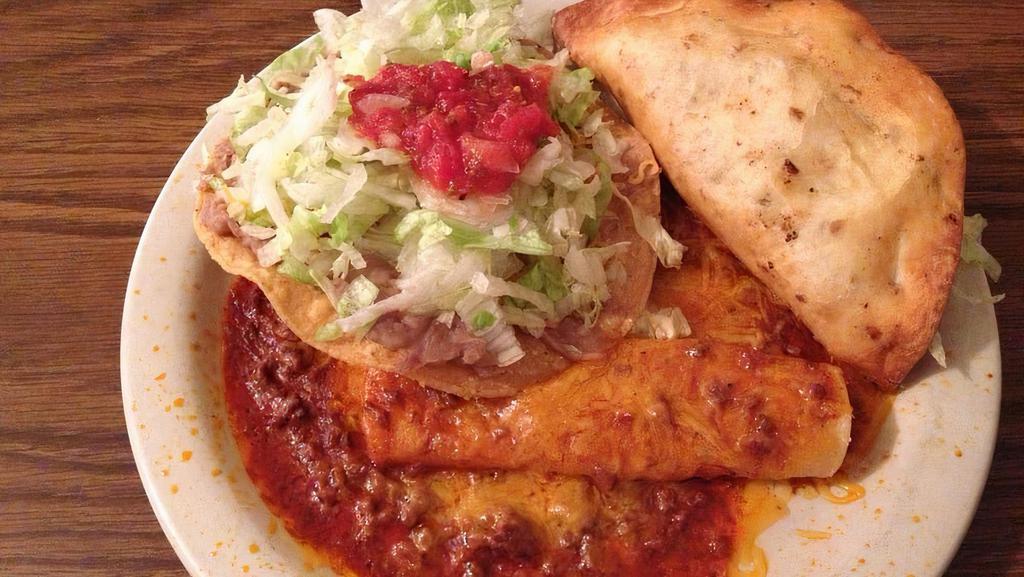 Single Combination · A flour fried beef taco, a cheese enchilada and a corn-bean tostada.