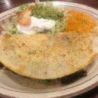 Fajita Quesadilla · A floor tortilla filled with your choice of steak, chicken or combination with sautéed bell ...