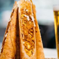 Chicken Flautas · Crisp flour tortilla filled with shredded chicken, corn, and chihuahua cheese; served with a...