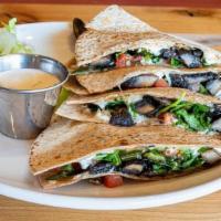 Mushroom Quesadilla · Crisped wheat tortilla with melted Chihuahua and goat cheese, grilled portobello mushrooms, ...
