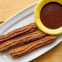 House Made Churros · Mexican pastry - crispy on the outside, soft in the middle - coated with cinnamon-sugar; ser...