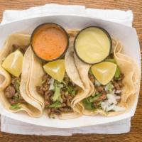 Carne Asada Street Tacos · 4 tacos. Marinated, thinly sliced grilled steak topped with cilantro, onions, lime and choic...