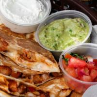 Quesadilla · A grilled flour tortilla stuffed with your choice of protein and cheese. Served with a side ...