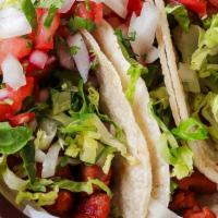 Dos Hermanos Tacos · 3 Soft corn tortillas filled with your choice of meat then topped with lettuce, cheese, pico...