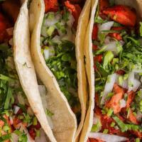 Mexican Street Tacos · 3 Soft corn tortillas filled with your choice of meat then topped with onions and cilantro. ...