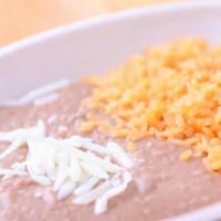Rice And Beans · a side of Mexican rice and refried beans