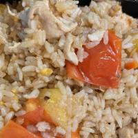 Pineapple Fried Rice · Stir-fried rice with egg, onion, tomatoes, carrots, pineapples and cashew nuts.