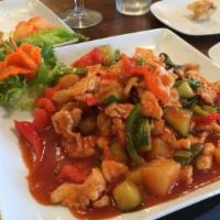 Pad Sweet & Sour · Sautéed cucumber, scallions, tomatoes, onions, bell peppers and pineapple in sweet-sour sauce.
