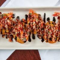 Bruschetta · Toasted crostini points, basil, tomatoes, parmesan, garlic olive oil, and balsamic reduction.