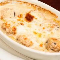 Mushrooms Crabmeat · Crabmeat stuffed caps, baked in a Marsala wine cream sauce, topped with mozzarella cheese. G...
