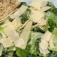 Caesar Salad · Romaine, green leaf, handmade croutons topped
with shaved parmesan cheese in a slightly swee...