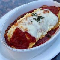 Cheese Ravioli · Vegan.Cheese-filled pasta pockets baked in our house-made marinara and topped with fresh moz...