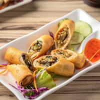 Crispy Spring Roll · Nut-free. Our house-made spring rolls are filled with cabbage, wood ear mushroom, carrot & s...