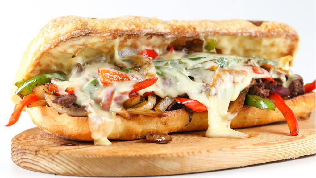 Philly Cheesesteak Sandwich · Delicious sandwich made with Beef steak, melted cheese, sautéed onions, and green peppers.