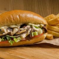 Philly Cheesesteak Sandwich With Hot Peppers & Mushrooms · Delicious sandwich made with Beef steak, melted cheese, hot peppers, mushrooms, sautéed onio...
