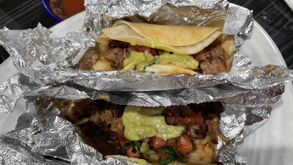 Tacos De Carnitas · Three carnitas tacos, served with rice, beans, and pico de gallo, and hot salsa.