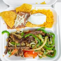 Steak Fajitas · Steak sauteed, green peppers, onion, and tomatoes. Served with rice, beans.