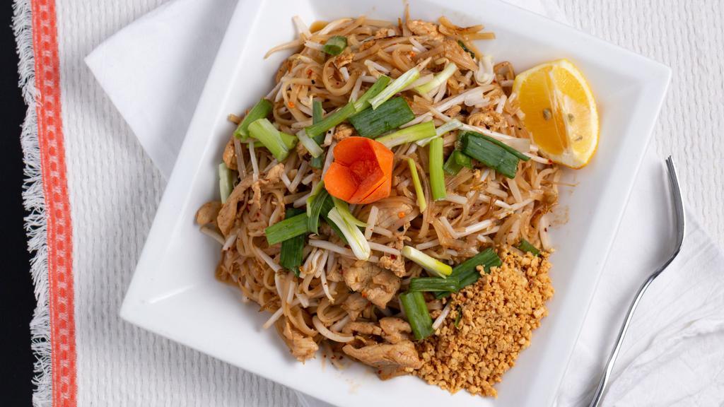 Pad Thai · A famous Thai dish that will leave you wanting more! stir fry rice noodles with eggs, bean sprouts, and green onions. Served with roasted peanuts and a side of lemon wedge.