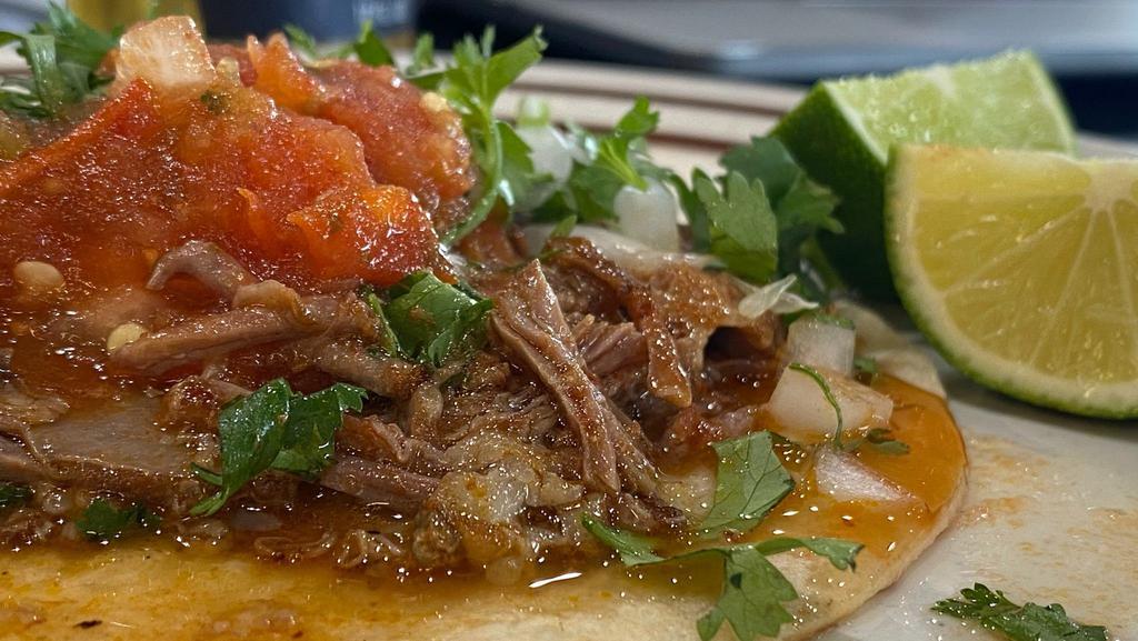 Taco De Birria · Served with your choice of ingredients; onions, cilantro.