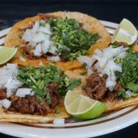 Taco De Birria · Served with your choice of ingredients; onions, cilantro.