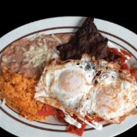 Chilaquiles Con Carne · Green or red and eggs your way. Served with rice and beans.