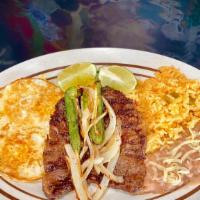 Desayuno Especial · Choices are: grilled skirt steak accompanied with 2 eggs, eggs with chorizo, Mexican eggs, e...
