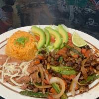 Fajitas De Res / Steak Fajitas · Grilled steak, onions, bell pepper, avocado, lettuce and tomatoes. Sided with fried beans an...