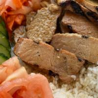 Com - Rice Bowl · Choice of brown or white rice and protein. served with a side of cucumber, tomato, pickled c...
