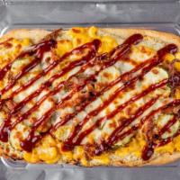 Bourbon Chicken Mac Flatbread · Garlic Sauce base, mozzarella, mac n cheese, chicken, mushrooms, onions,  bourbon sauce on top