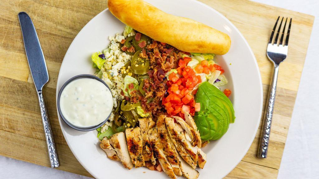 Cobb Salad Bowl · mixed greens, grilled chicken, avocado, jalapeño, bacon, tomato, bleu cheese crumbles. Served with breadstick.