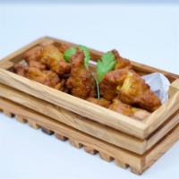 Chicken Pakora · Marinated chicken Strips, battered in a Special seasoning of gram flour, deep-fried for juic...