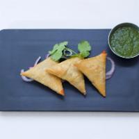 Vegetable Samosa (3) · Crispy fried triangular pastry, stuffed with seasoned mashed potatoes green peas, mint, cila...