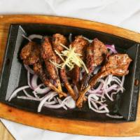Mutton Chops · Double cut baby goat chops tenderized and marinated in a house special masala blend.