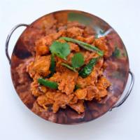 Chicken Sixty-Five · Crispy fried cubes of Chicken in a Zesty red tomato sauce with the scent of curry leaves and...