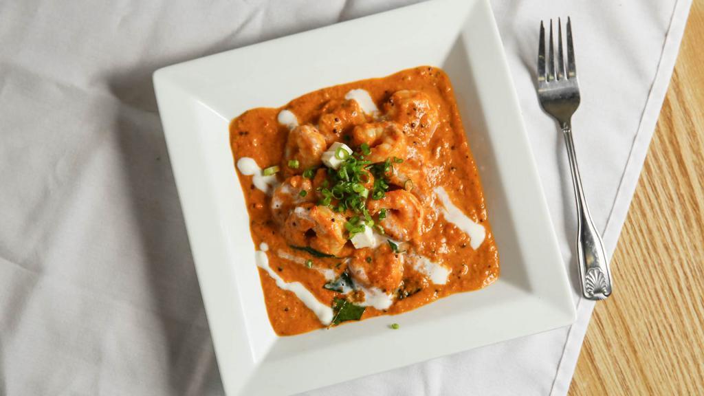 Shrimp Masala · Shrimp sautéed with an onion and tomato-based curry with fresh cream and authentic spices and a kick of curry leaves.