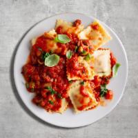 Ravioli Pasta Rave · House made ravioli filled with ricotta, mozzarella, Romano, and Parmesan cheese baked with m...