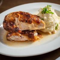 Half Rotisserie Chicken · wood-roasted and lightly seasoned with our signature spice blend.  Served with your choice o...