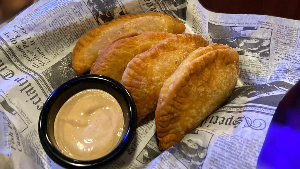 Traditional Latin Empanadas · Four served with your choice of side. The Original 