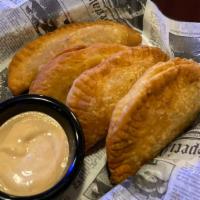 Traditional Latin Shrimp And Scallop Empanadas · Four served with your choice of side. The Original 