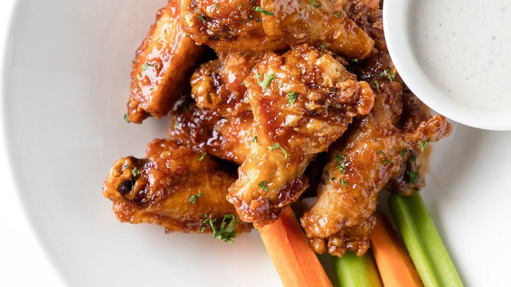 Chicken Wings · sauce of choice of buffalo, bourbon bbq, bbq, or tangy peach bbq + celery + carrots + choice of blue cheese or ranch