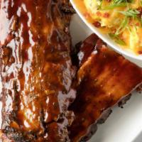 Baby Back Ribs · 15 spice dry rub + french fries + cole slaw + choose your sauce