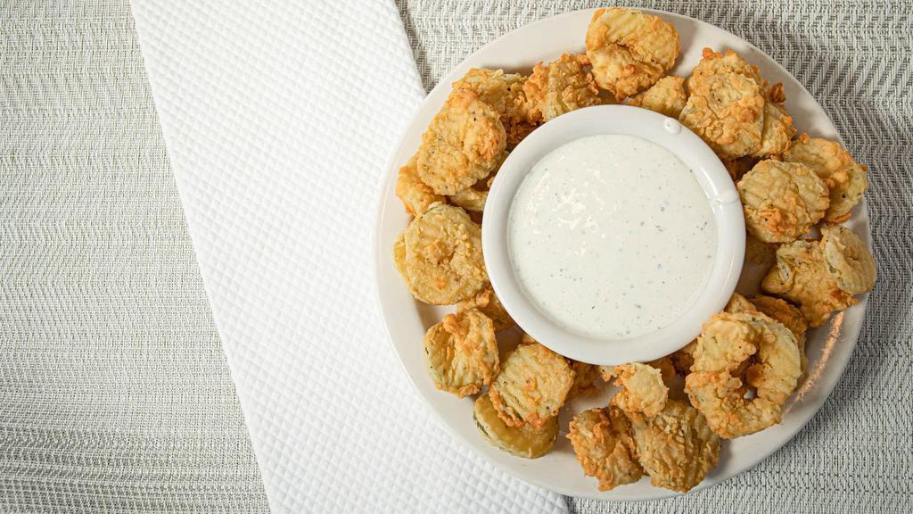 Fried Pickles · Deliciously fried pickle chips served with ranch.