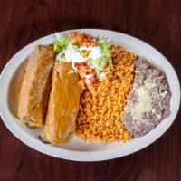 Chile Relleno Dinner · (2) stuffed peppers with cheese wrapped in egg batter topped w/ranch sauce, rice, beans.