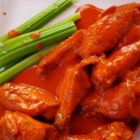Loco Chicken Wings · Ten fresh chicken wings fried and glazed with mild buffalo sauce. Served with celery and com...