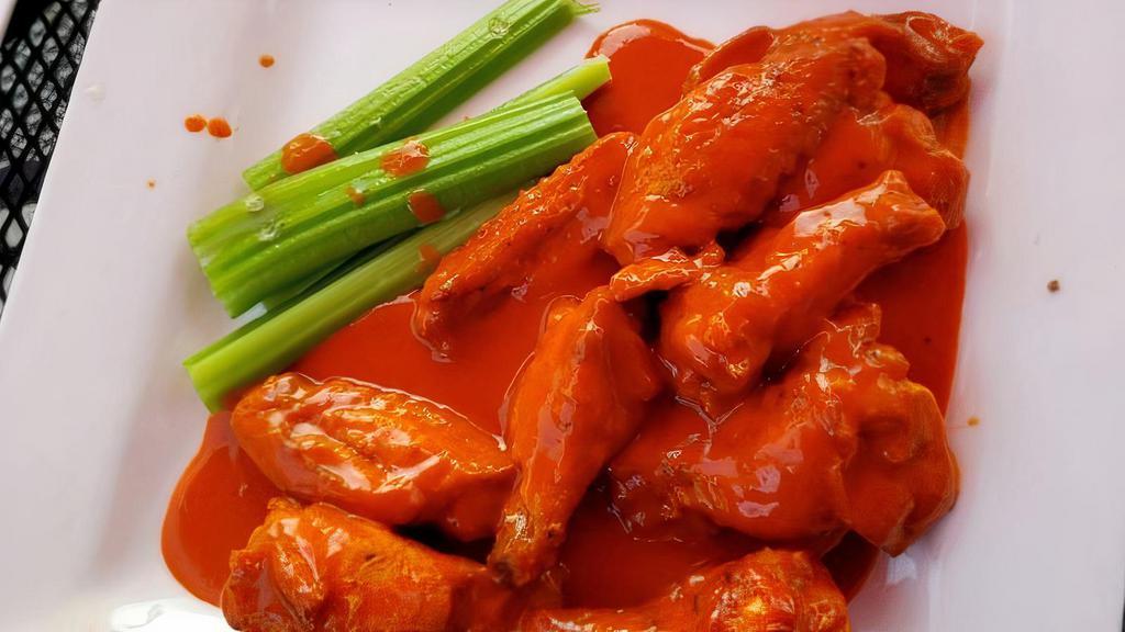 Loco Chicken Wings · Ten fresh chicken wings fried and glazed with mild buffalo sauce. Served with celery and comes with a dressing.