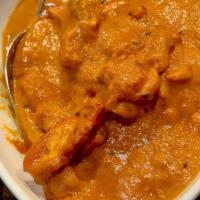 Butter Chicken · Chicken cooked with spices, herbs, and butter sauce.